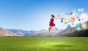Girl in red dress. Young cheerful lady in red dress jumping high