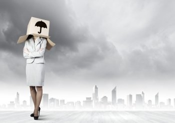 Woman with box on head. Businesswoman wearing carton box with sign on head
