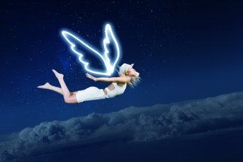 Angel girl flying high. Cute girl with angel drawn wings on dark sky background