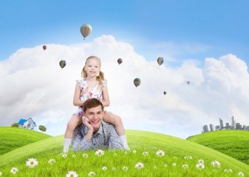 Happy parenting. Happy family of father and daughter lying on green grass