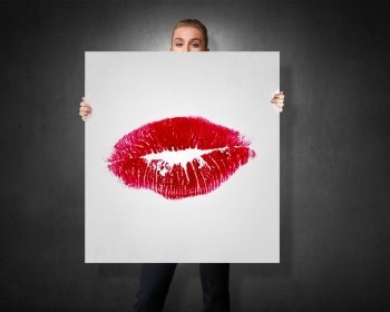 Red lipstick kiss. Young businesswoman showing white banner with red lips