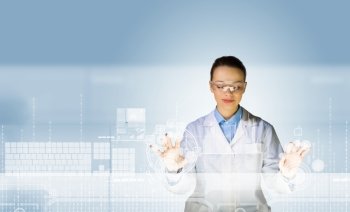 Innovation technologies. Image of young woman scientist touching icon of media screen