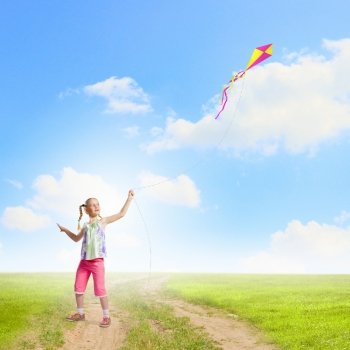 Girl with kite. Image of little girl playing with kite at meadow