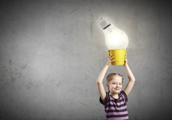 I’ve got an idea!. Cute girl with bucket and light bulb in it