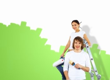 Young caucausian couple with paint brushes together
