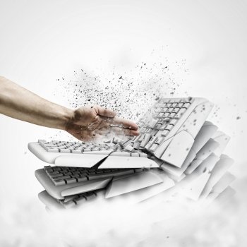 Computer addiction. Image of human hand breaking pile of keyboards