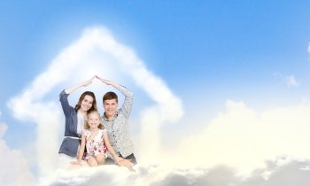 Young family. Happy family of three lying on white cloud