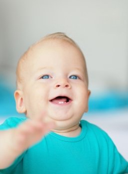 Baby boy with blue eyes portrait