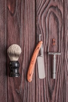 Vintage barber shop tools on wooden background. Vintage barber shop tools on old wooden background