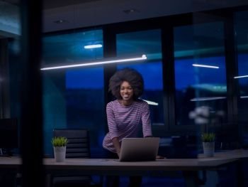 Young african american female Entrepreneur Freelancer Working Using A Laptop In Coworking space