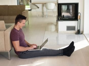 Real man Using laptop on the floor At Home  Enjoying Relaxing