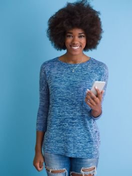 Young Happy African American Woman Using mobile phone  Isolated on a blue background