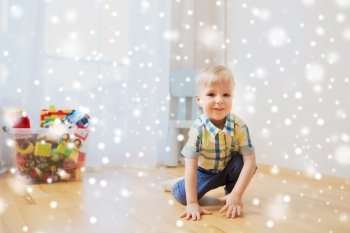 childhood and people concept - happy little baby boy at home over snow. happy little baby boy at home