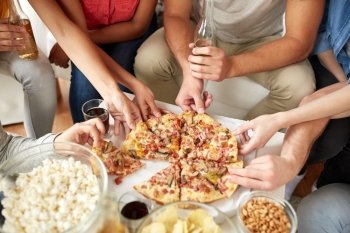 fast food, eating, party and people concept - close up of people taking pizza slices at home