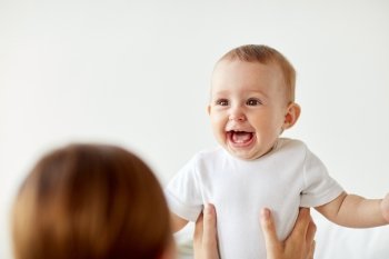 family, children and people concept - happy little baby with mother at home
