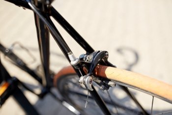 transport and vehicle concept - close up of fixed gear bicycle on street. close up of fixed gear bicycle on street