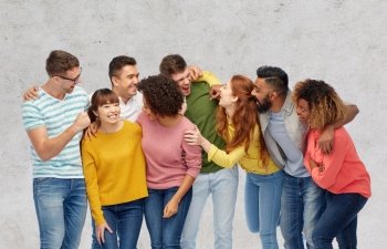 diversity, race, ethnicity and people concept - international group of happy men and women laughing over gray concrete background. international group of happy laughing people