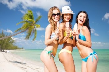 summer holidays, vacation, food, travel and people concept - group of smiling young women eating ice cream over exotic tropical beach with palm trees background. group of smiling women eating ice cream on beach