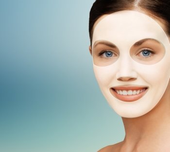 beauty, cosmetology, hydration, people and rejuvenation concept - close up of beautiful young woman with collagen facial mask over blue background. close up of woman with collagen facial mask