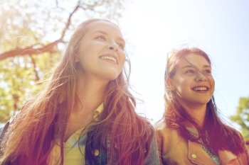friendship and people concept - portrait of two happy teenage student girls or friends outdoors. happy teenage student girls or friends outdoors