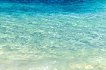 travel, tourism, vacation and summer holidays concept - sea or ocean with transparent blue water. sea or ocean with transparent blue water