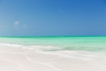 travel, tourism, vacation and summer holidays concept - sea and sky on exotic tropical beach. sea and sky on exotic tropical beach