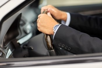 transport, business trip and people concept - senior businessman hands driving car. senior businessman hands driving car