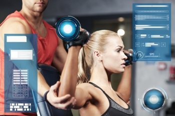 sport, fitness, bodybuilding, exercising and people concept - man and woman with dumbbells flexing muscles in gym over virtual charts. man and woman with dumbbells in gym