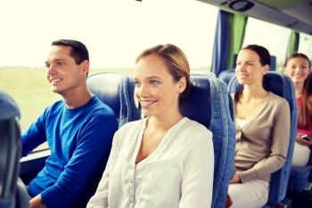 transport, tourism, road trip and people concept - group of happy passengers or tourists in travel bus. group of happy passengers in travel bus