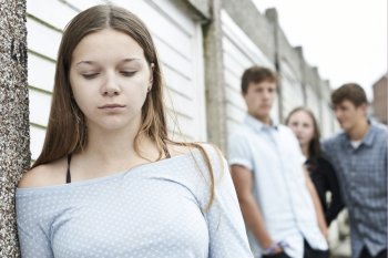 Unhappy Teenage Girl Being Talked About By Peers