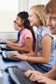 Female Elementary Pupil In Computer Class 