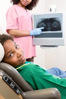 Dental nurse showing patient x ray