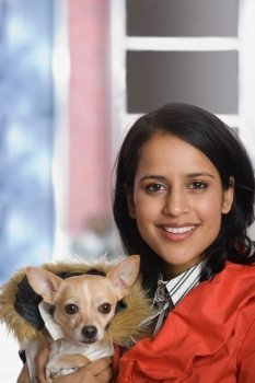 Young woman with pet chihuahua