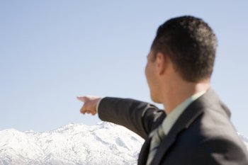 Man pointing at mountains