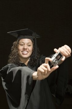 Female graduate taking a self portrait
