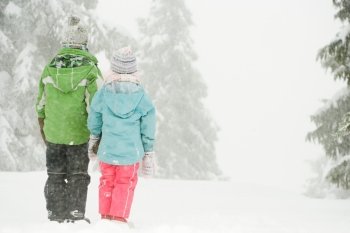 Children standing in the snow