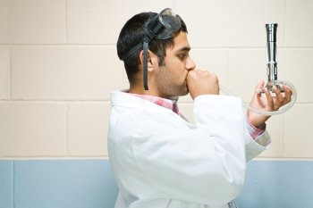 Male student performing an experiment