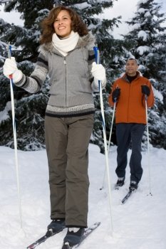 Mature couple skiing