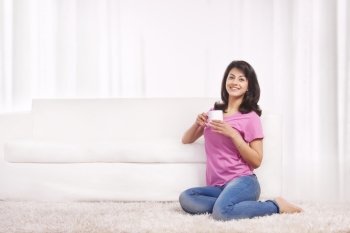 Portrait of a woman drinking tea