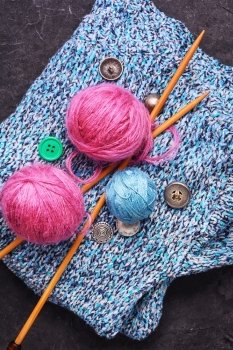 Close-up of tool knitting. Set knitting wool and knitting needles and buttons