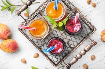 Smoothies with apricot and currant. apricot and berry smoothies in a stylish metal basket