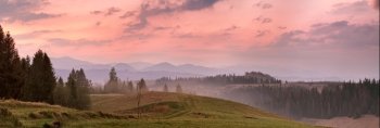 Red mountain morning panorama. Colorful dawn. High mountain landscape in haze