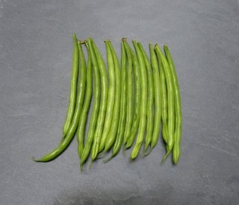 Green string beans on slate
