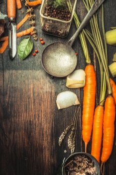 Rustic wooden food background with cooking spoon , vegetables and ingredients, top view, place for text