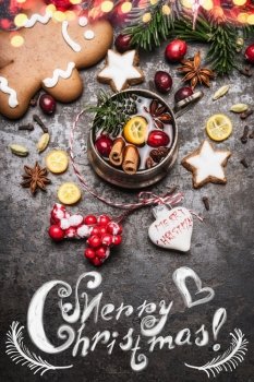 Merry Christmas card with mug of mulled wine with spices, cookies, gingerbread man and holiday decorations, top view