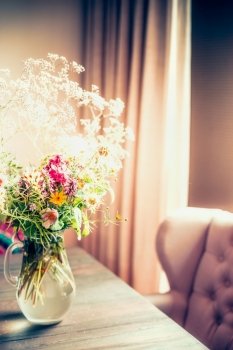 Bouquet of Flowers in Vase on a table by the window, cozy home interior