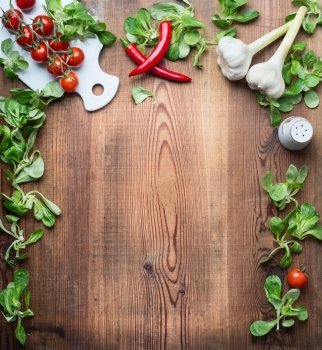 Healthy food background for recipes, menu or list with various fresh organic vegetables and condiment ingredients for salad or cooking on rustic wooden background, top view, frame.