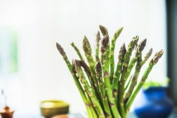 Close up of green asparagus bunch, front view