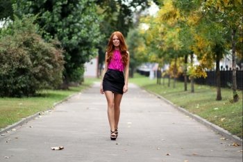 Beautiful redhead woman in a dress 