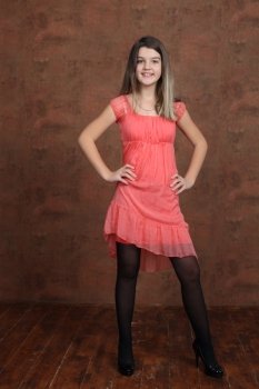 Full length of a beautiful  little girl in dress - wall copy space